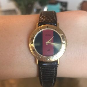 Vintage Gucci watch with black leather band